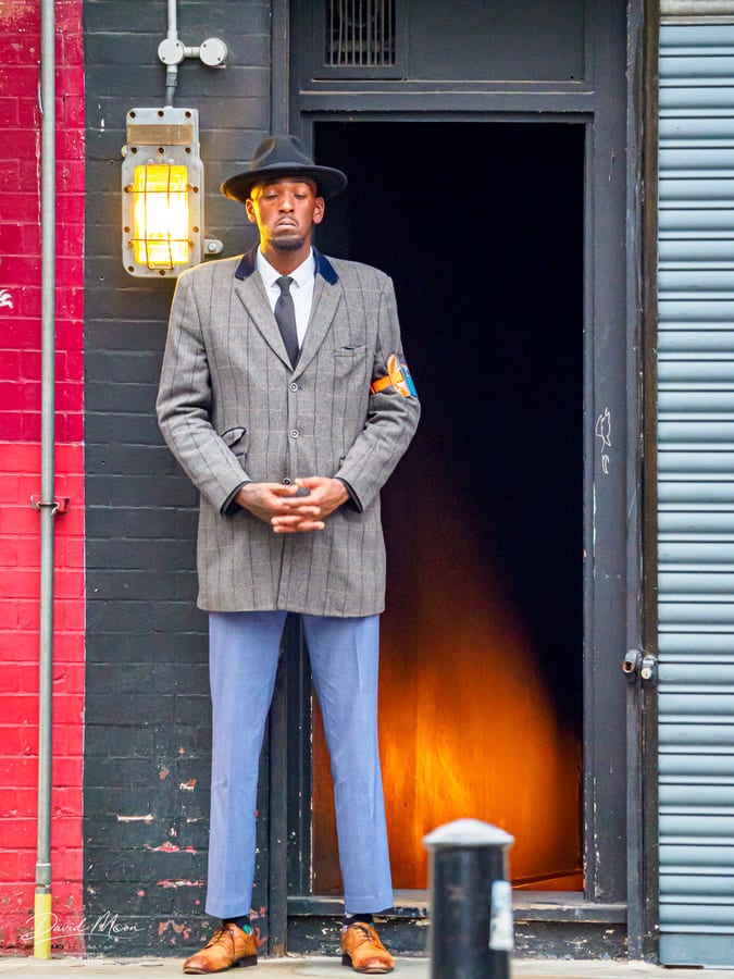 Streets of London - man in suit watching stairway entrance, London, England