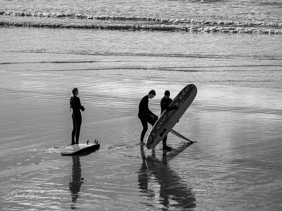 Surfers at Newgale Beach, Newgale, Wales, UK