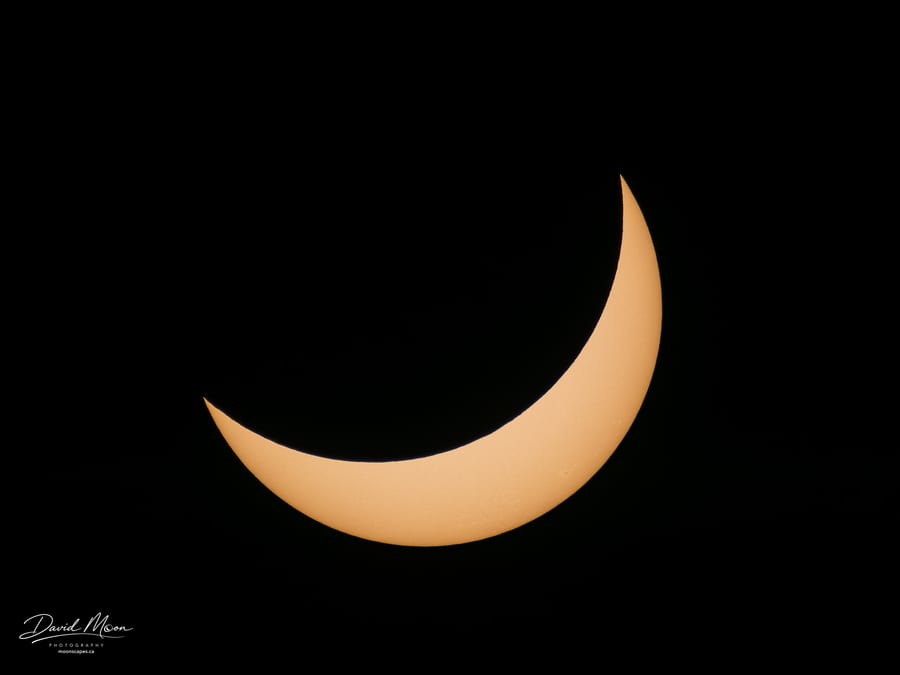 Post-Totality Crescent and Sunspot