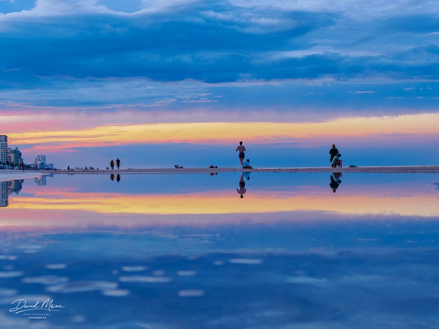Figures Reflected at Dusk