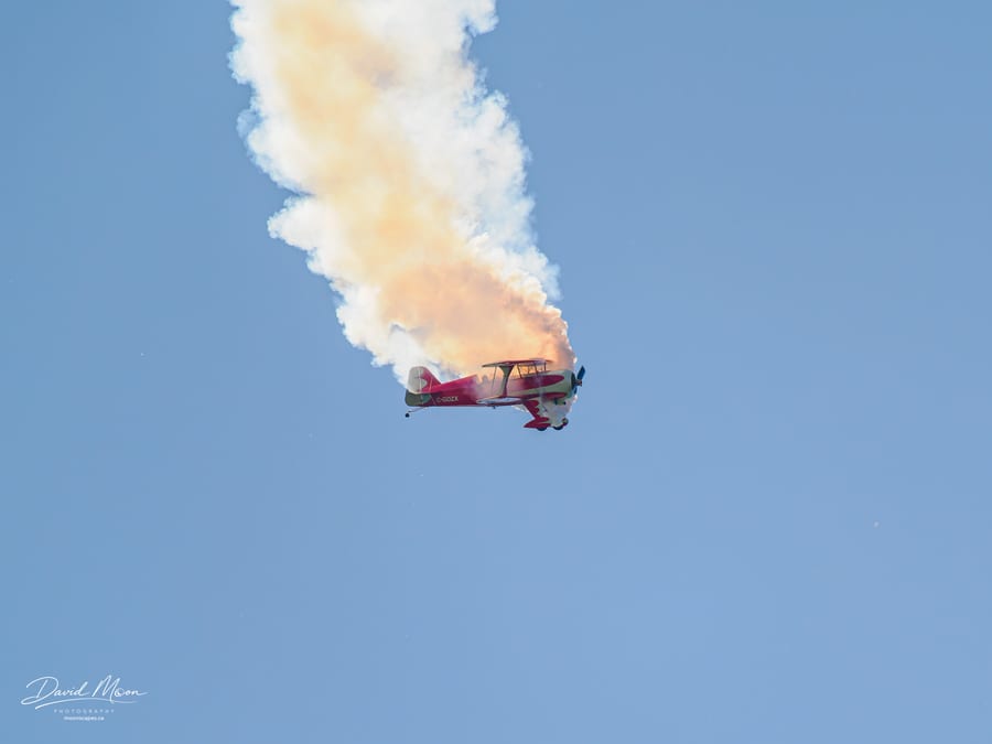 Biplane beneath the Smoke