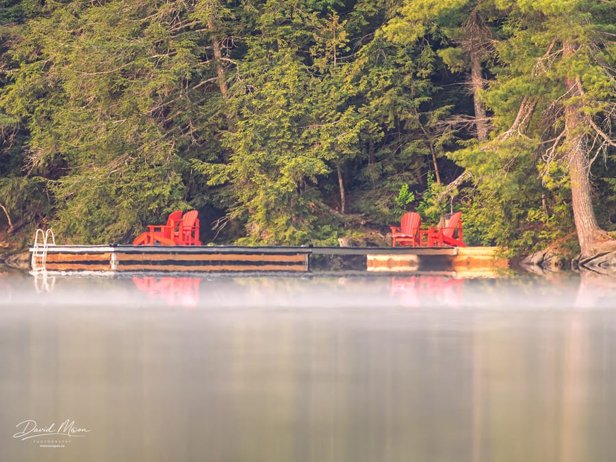 Red Chairs across the Mist